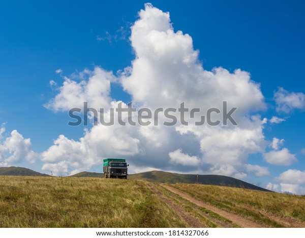 Military off-road truck on the mountain top.\
Borzhava, Ukraine