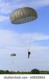  Military Parachute Jumper  On Blue Sky Background