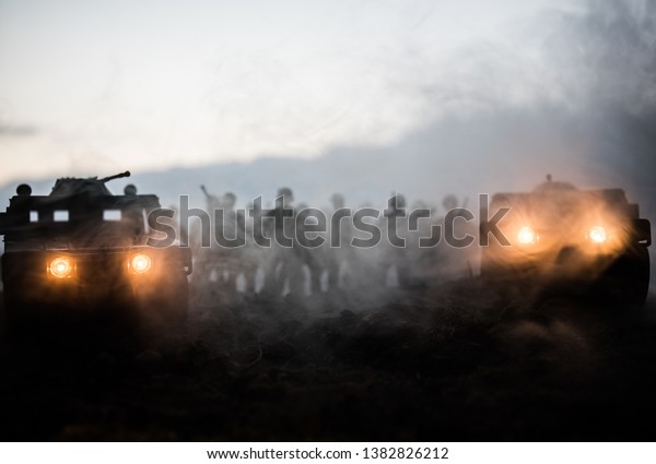 Military patrol car on sunset background.
Army war concept. Silhouette of armored vehicle with soldiers ready
to attack. Artwork decoration. Selective
focus