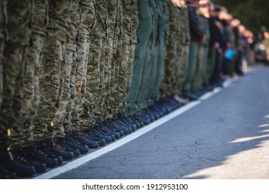 Military personnel lined up at a military show  - Powered by Shutterstock