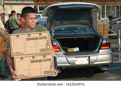 Military Personnel Load Cars With Emergency Supplies. Taken At Hurricane Katrina Relief Center In Biloxi, MS On September 5, 2005.