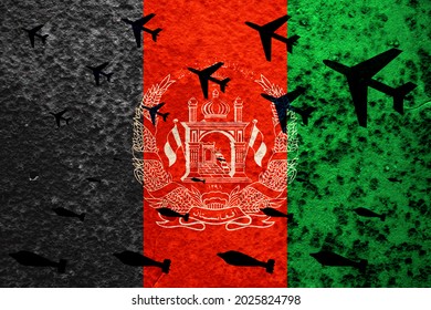 Military Planes Are Bombing Against The Background Of The Afghan Flag. The Conflict In Afghanistan. The War In Afghanistan