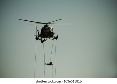 Military Rappelling From Helicopter