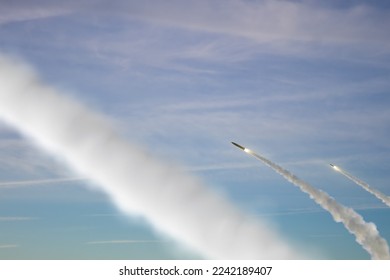 Military rockets are flying against the sky, smoke and fire from the rocket. Concept: missile attack, air alert, war between Russia and Ukraine, missile strike, shelling.