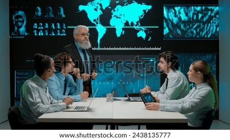 Military and Science Concept. A multinational team of military analysts and scientists discuss research data on a large digital screen.