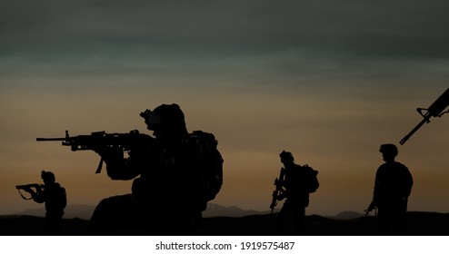 Military Silhouettes Of Soldiers Against The Backdrop Of Sunset Sky