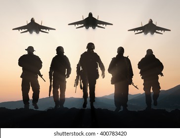 Military Silhouettes Of Soldiers And Airforce Against The Backdrop Of Sunset Sky.