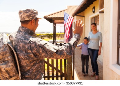 Military Soldier Arriving Home With Family Welcoming Him