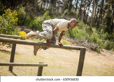 Military Soldier Training On Fitness Trail At Boot Camp