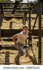 Military Soldier Training Rope Climbing At Boot Camp