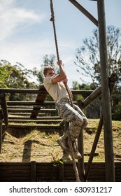 Military Soldier Training Rope Climbing At Boot Camp