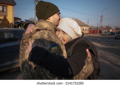 Military son hugs an elderly mother goodbye. Mom hugs a Ukrainian soldier. militarization. The Ukrainian defender says goodbye to his family. Mobilization of Ukrainian men. War in Ukraine