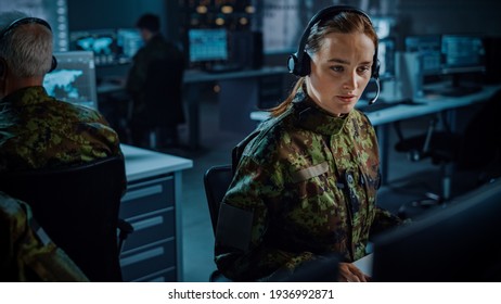 Military Surveillance Team Of Officers In Headsets Working In A Central Office Hub For Cyber Operations, Control And Monitoring For Managing National Security, Technology And Army Communications.