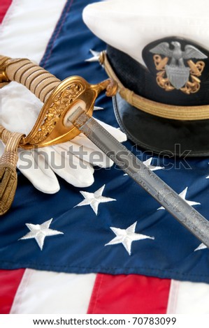 military sword and gloves on US flag