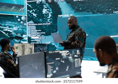 Military team in a command post base uses advanced technology, including satellite imagery and surveillance cctv systems. Support strategic planning and monitor potential threats, army operations.
