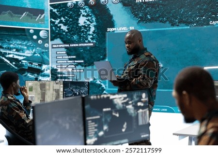Military team in a command post base uses advanced technology, including satellite imagery and surveillance cctv systems. Support strategic planning and monitor potential threats, army operations.