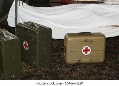 Military Tent Hospital. A Mobile Medical Tent With A Stretcher And Medical Bags. First Aid To Victims.