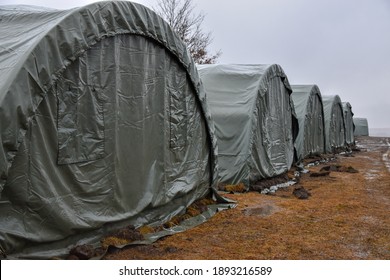 Military Tents Set Up On The Meadow. Migrant Camp Lipa In Bihac, Bosnia And Herzegovina. Military Tents Where Migrants Sleep In A Camp.