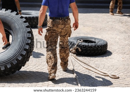 Military Training: Fitness Workout and Activities with Huge Truck Tires.