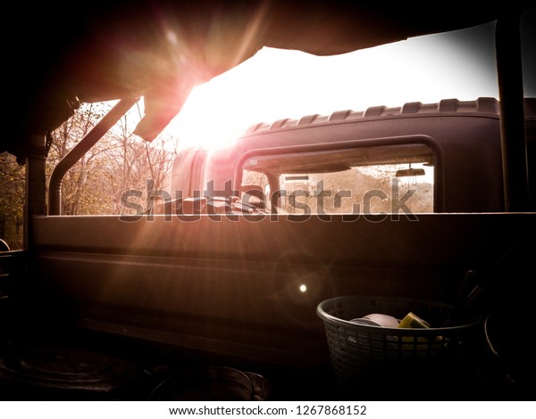Military vehicle carrying food and water to\
Territorial Defense Student at Khao Chon Kai Training Camp,\
Thailand during sunset