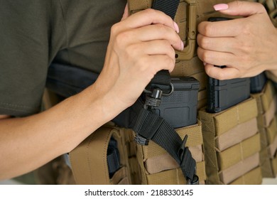 Military Woman In A Bulletproof Vest And With A Weapon