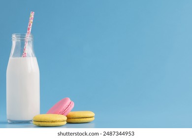 Milk bottles with retro striped straws - Powered by Shutterstock