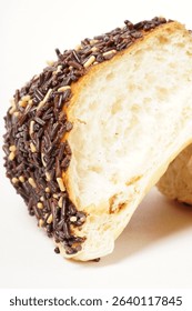 Milk bread with a soft white interior, topped generously with chocolate sprinkles and a touch of white topping. Photographed against a clean white background.