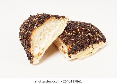 Milk bread with a soft white interior, topped generously with chocolate sprinkles and a touch of white topping. Photographed against a clean white background.