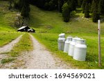 Milk cans on a path leading to an alpine cabin near Saemtisersee Lake, 1230m, Bruelisau, Appenzell Innerrhoden or Inner Rhodes, Switzerland, Europe, PublicGround