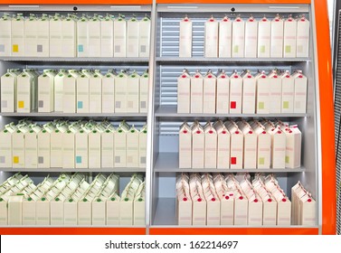 Milk In Carton Packaging At Store Shelf