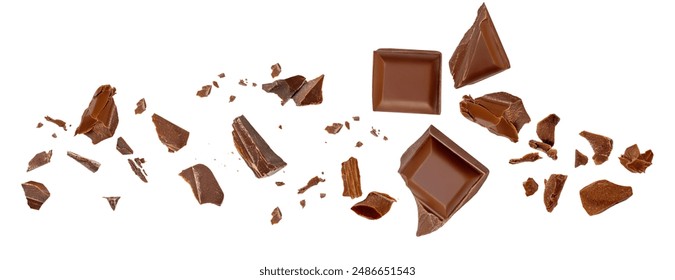  Levitating milk chocolate chunks isolated on white background. Broken chocolate bar pieces and cocoa crumbs explotion  on white background. Chocolate collection
