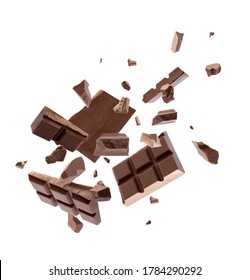 Milk chocolate pieces falling on white background - Shutterstock ID 1784290292