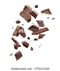 Milk chocolate pieces falling on white background - Shutterstock ID 1791511364