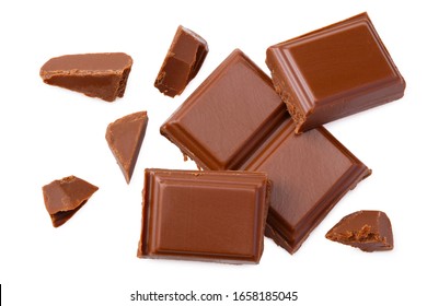 Milk Chocolate Pieces Isolated On White Background. Top View