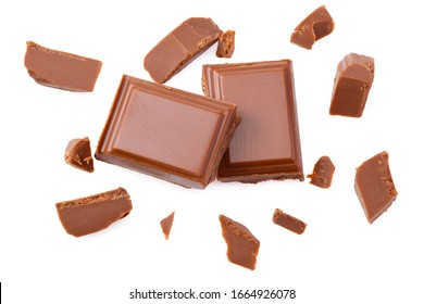 Milk Chocolate Pieces Isolated On White Background. Top View