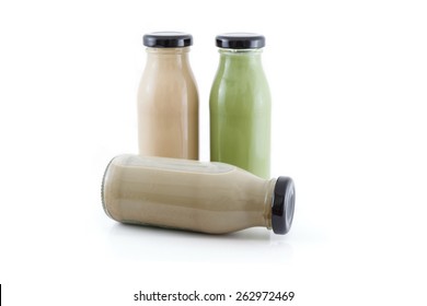 Milk Coffee, Mocha And Green Tea In Bottle  Isolated On White Ba