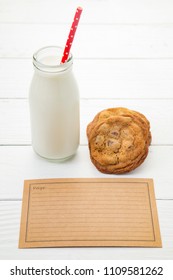 Milk And Cookies On A White Wood Table With A Recipe Card - Add Your Own Family Recipe