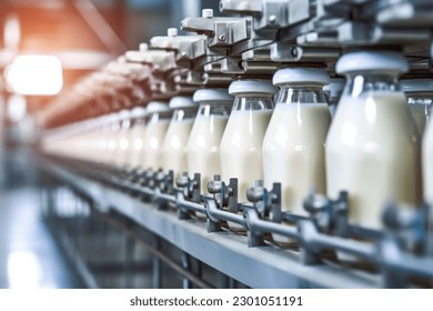 Milk factory. Robotic factory line for processing and bottling of milk. Selective focus. - Shutterstock ID 2301051191