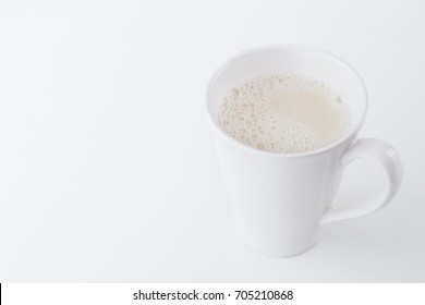 Milk glass on white wooden table. Healthy concept - Shutterstock ID 705210868