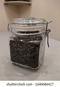 Milk Oolong Tea In A Glass Jar With A Latch On The Kitchen Table