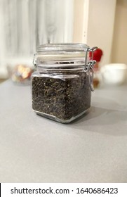 Milk Oolong Tea In A Glass Jar With A Latch On The Kitchen Table