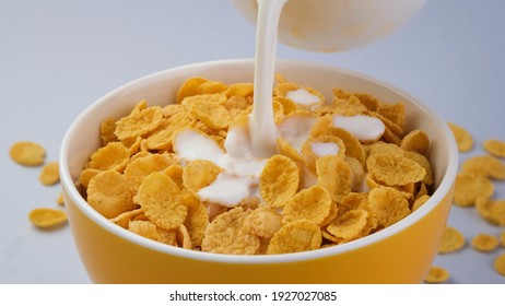 Milk Pouring Into Bowl Corn Flakes Stock Photo 1927027085 | Shutterstock