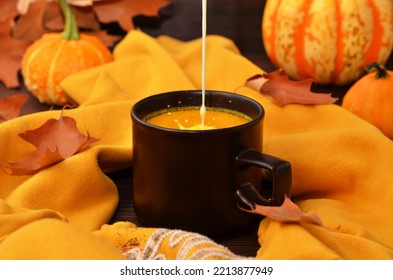 Milk Pouring Into A Cup Hot Autumn Drink