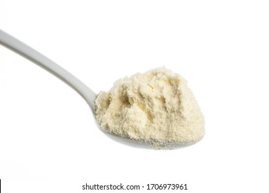 Milk Powder In A Spoon Close Up Shot Isolate In White Backgroud