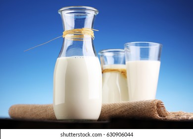 milk products - tasty healthy dairy products on a table on: and milk jar, glass bottle and in a glass