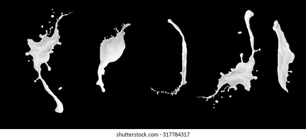 Milk splashes collection, isolated on black background close up 