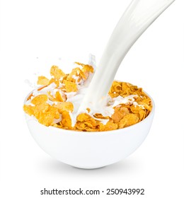 milk splashes into corn flakes bowl