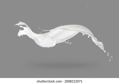 Milk splashes isolated on grey background. Real Shoot