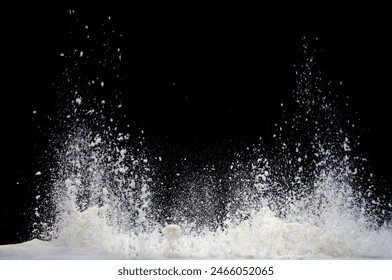 Milk splashes upward dramatically against a black background, captured in high-speed photography. - Powered by Shutterstock