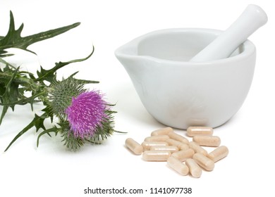 Milk Thistle With Capsules Near Mortar And Pestle On White Background